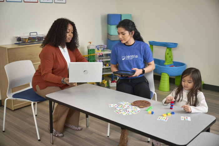 bcba and technician and child in a therapy session